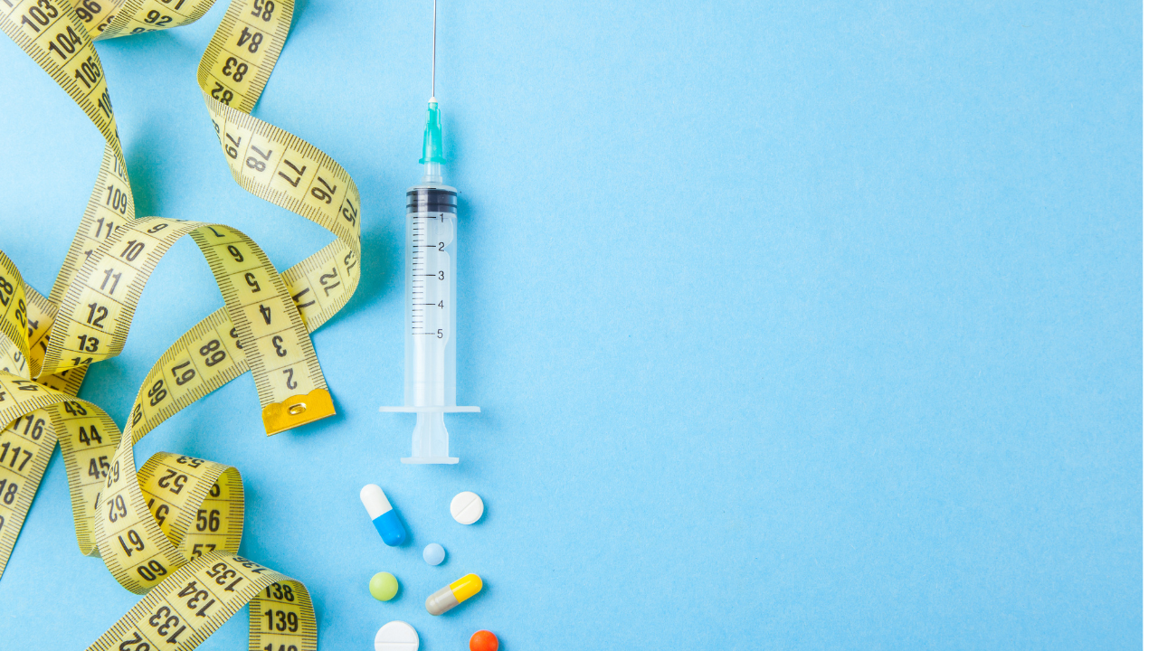 Injections for body beauty and weight loss. Tablets, syringe and yellow measuring tape. Image Credit: Adobe Stock Images/adragan