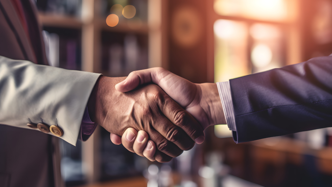 Businessman handshake for teamwork of business merger and acquisition,successful negotiate,hand shake,two businessman shake hand with partner to celebration partnership and business deal