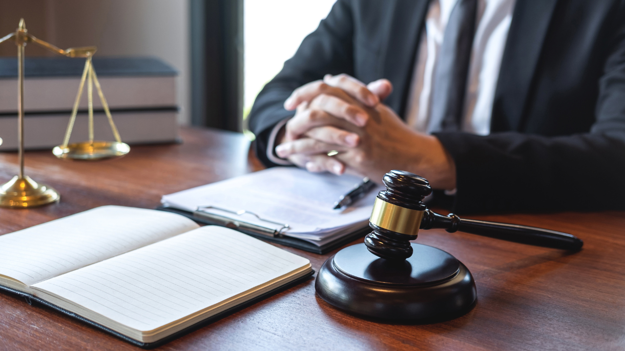 Professional male lawyer or counselor working with legal case document contract in office, law and justice, attorney, lawsuit concept. Image Credit: Adobe Stock Images/Thitiphat