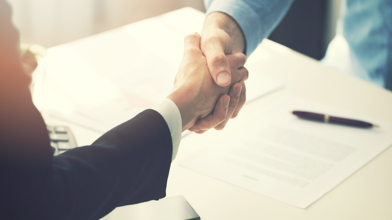 business people handshake after partnership contract signing. Image Credit: Adobe Stock Images/ronstik