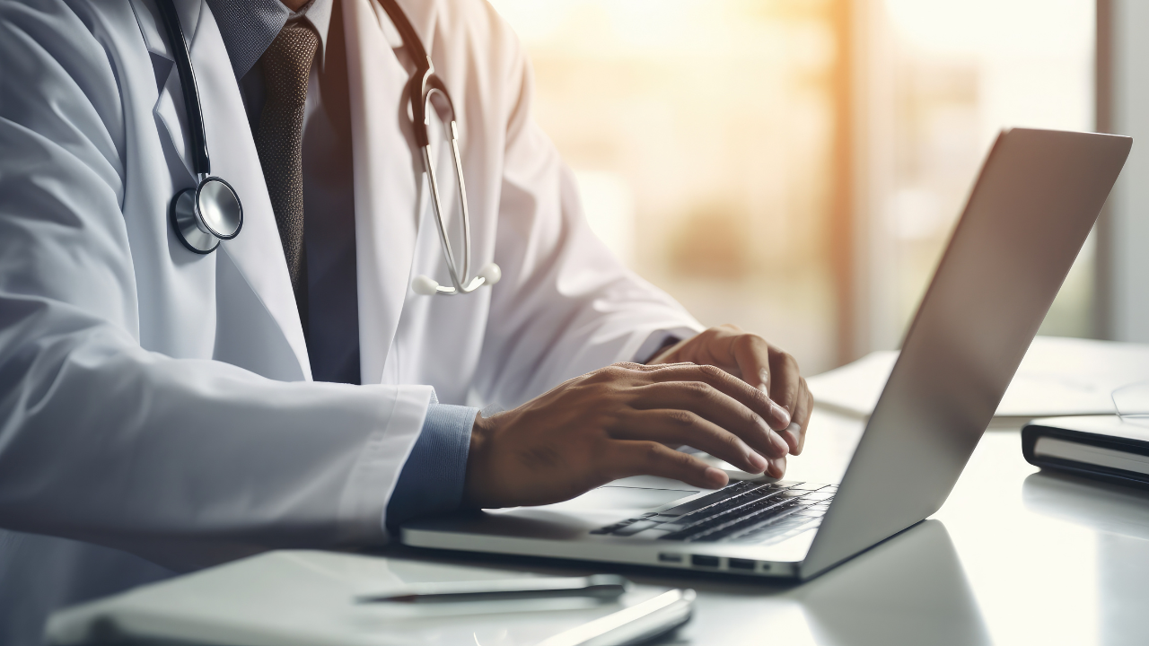 Close up of male asian doctor with stethoscope working and typing on laptop computer at doctor's office with digital,generative AI. Image Credit: Adobe Stock Images/Keat