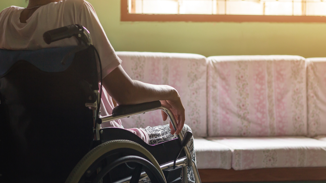 Asian senior or elderly old lady woman patient on wheelchair looking out the window so sad at home, healthy strong medical concept. Image Credit: Adobe Stock Images/saelim 