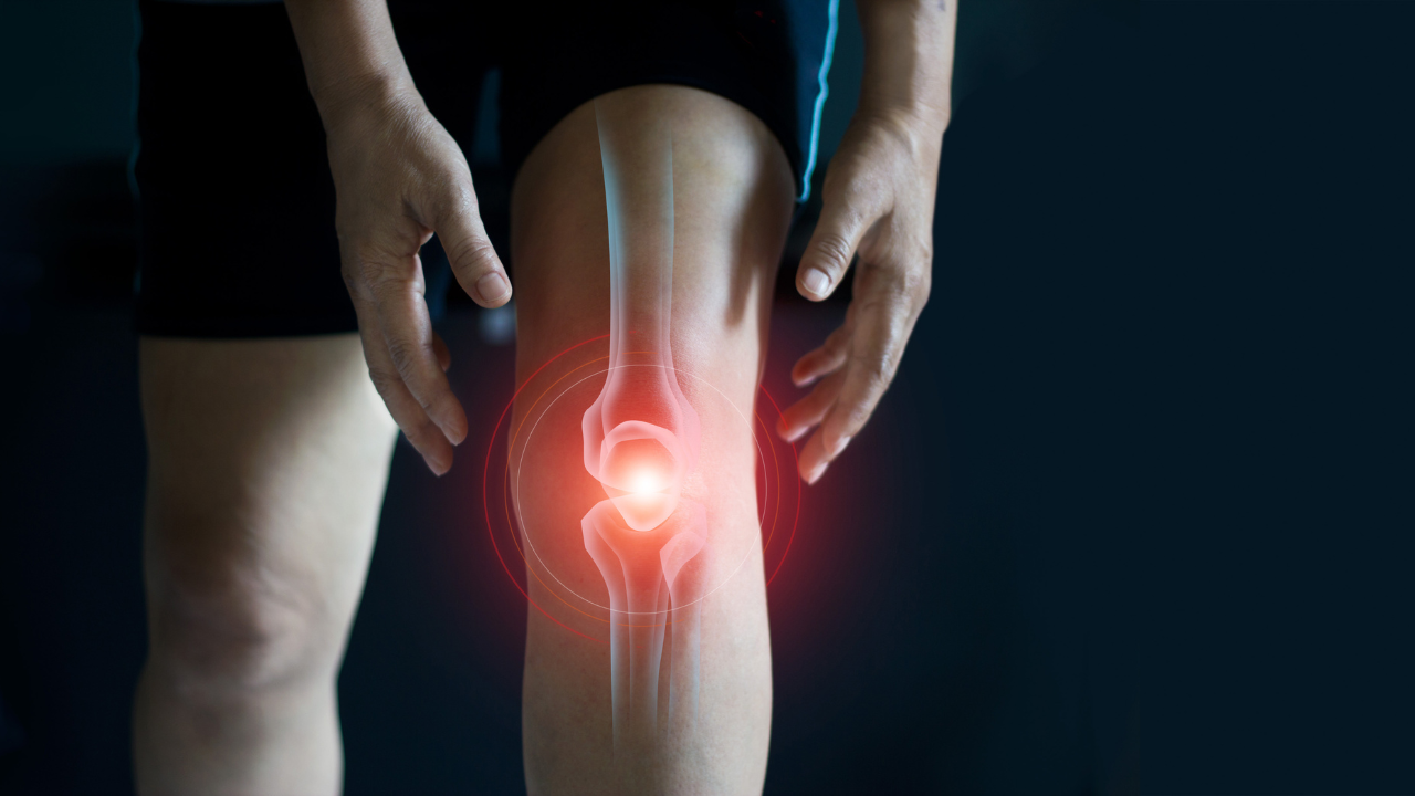 Elderly woman suffering from pain in knee. Tendon problems and Joint inflammation on dark background. Image Credit: Adobe Stock Images/ipopba 