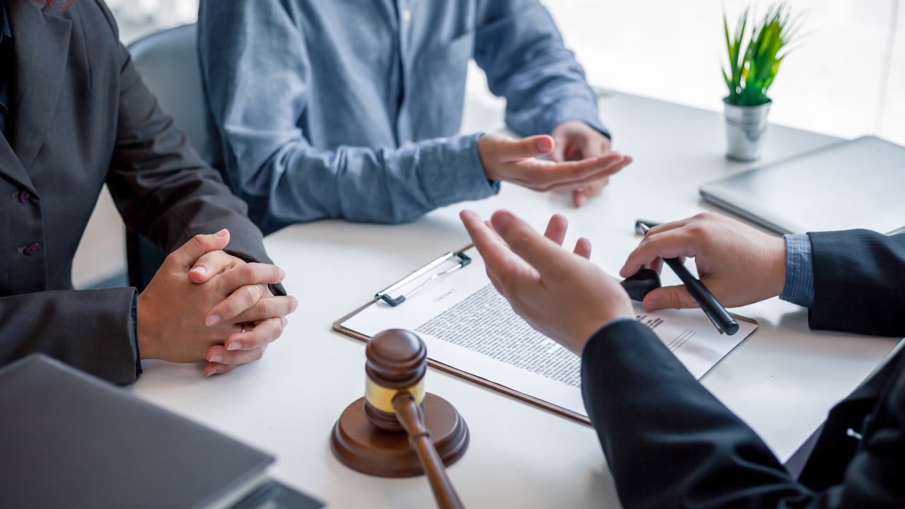 Businessman and lawyer discuss the contract document. Treaty of the law. Sign a contract business. Image Credit: Adobe Stock Images/amnaj