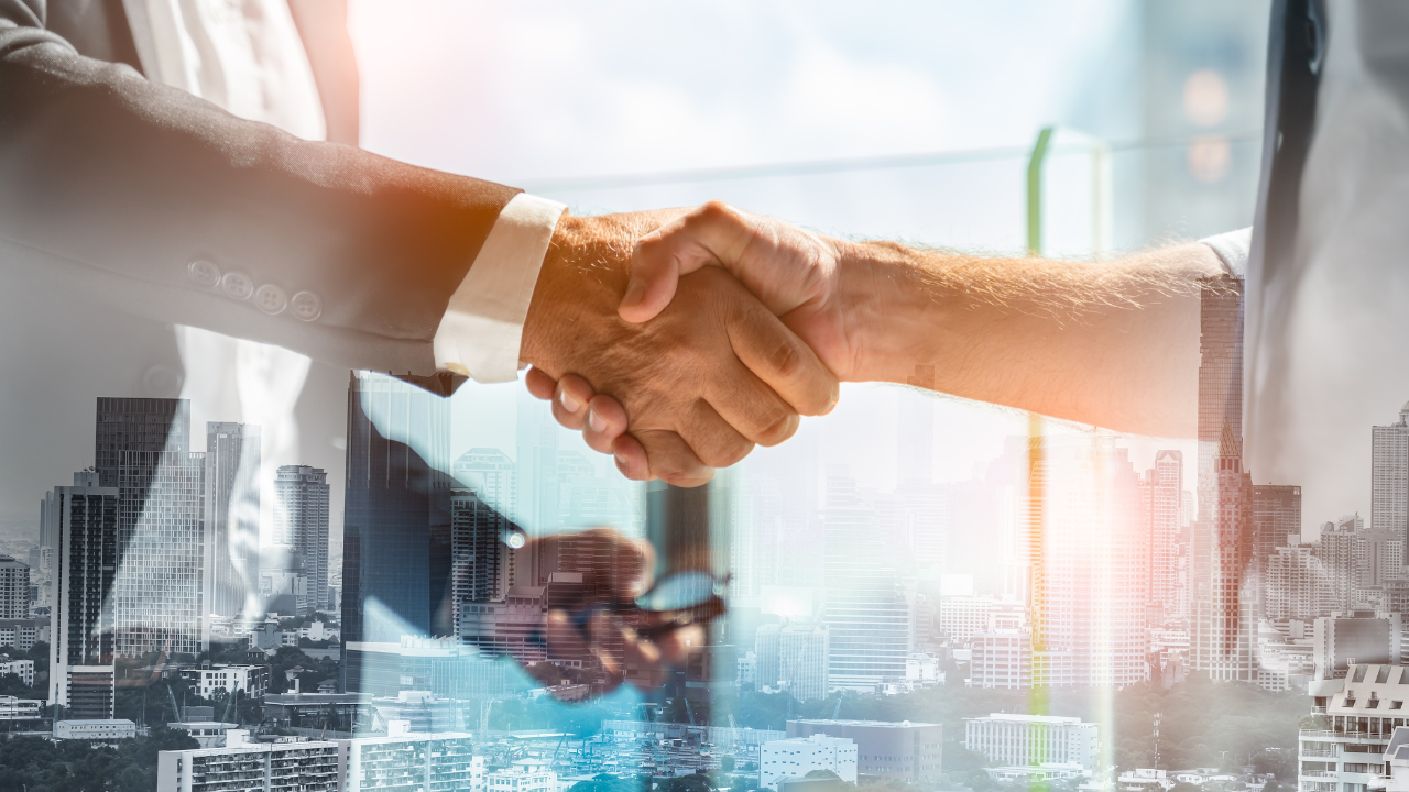Businessman handshake for teamwork of business merger and acquisition,successful negotiate,hand shake,two businessman shake hand with partner to celebration partnership and business deal concept. Image Credit: Adobe Stock Images/Yingyaipumi