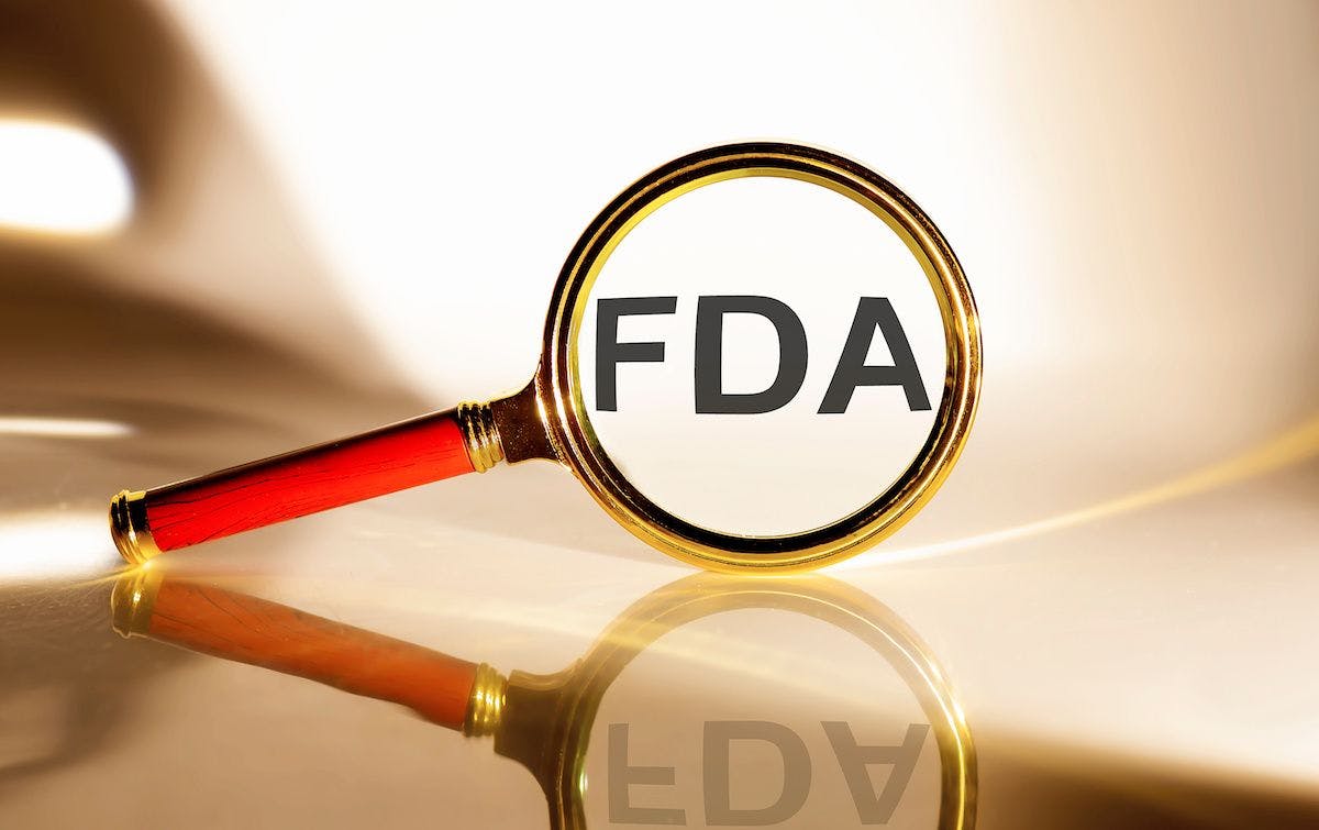 FDA concept. Magnifier glass with text on the white background in sunlight | ©Iryna | Adobe Stock