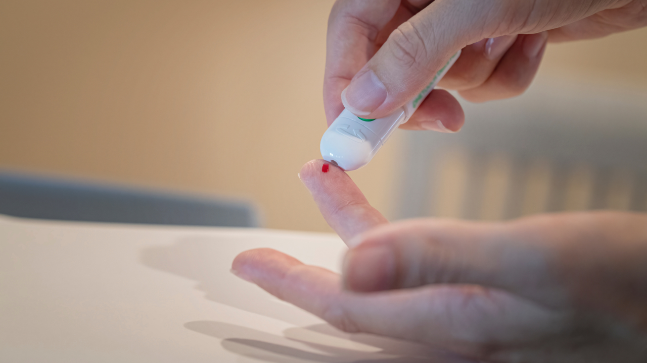 Woman administering a self diabetes stick test. Image Credit: Adobe Stock Images/Michael O'Neill 