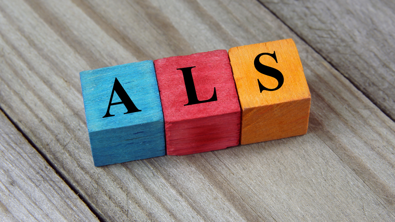 ALS (Amyotrophic Lateral Sclerosis) acronym on colorful wooden c. Image Credit: Adobe Stock Images/chrupka