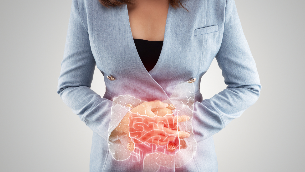 Illustration of large intestine is on the woman's body. Business Woman touching belly painful suffering from enteritis. internal organs of the human body. inflammatory bowel disease. Image Credit: Adobe Stock Images/eddows