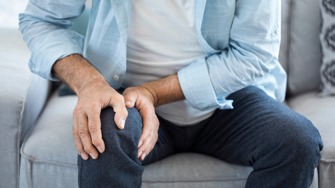 Old man suffering from knee pain. Image Credit: Adobe Stock Images/sebra