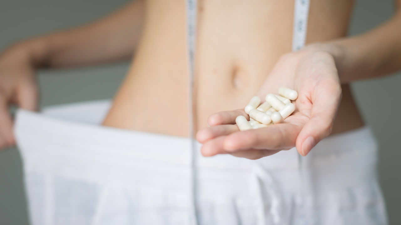 Diet pills. A woman successful with weight loss. Beauty and health. Image Credit: Adobe Stock Images/globalmoments
