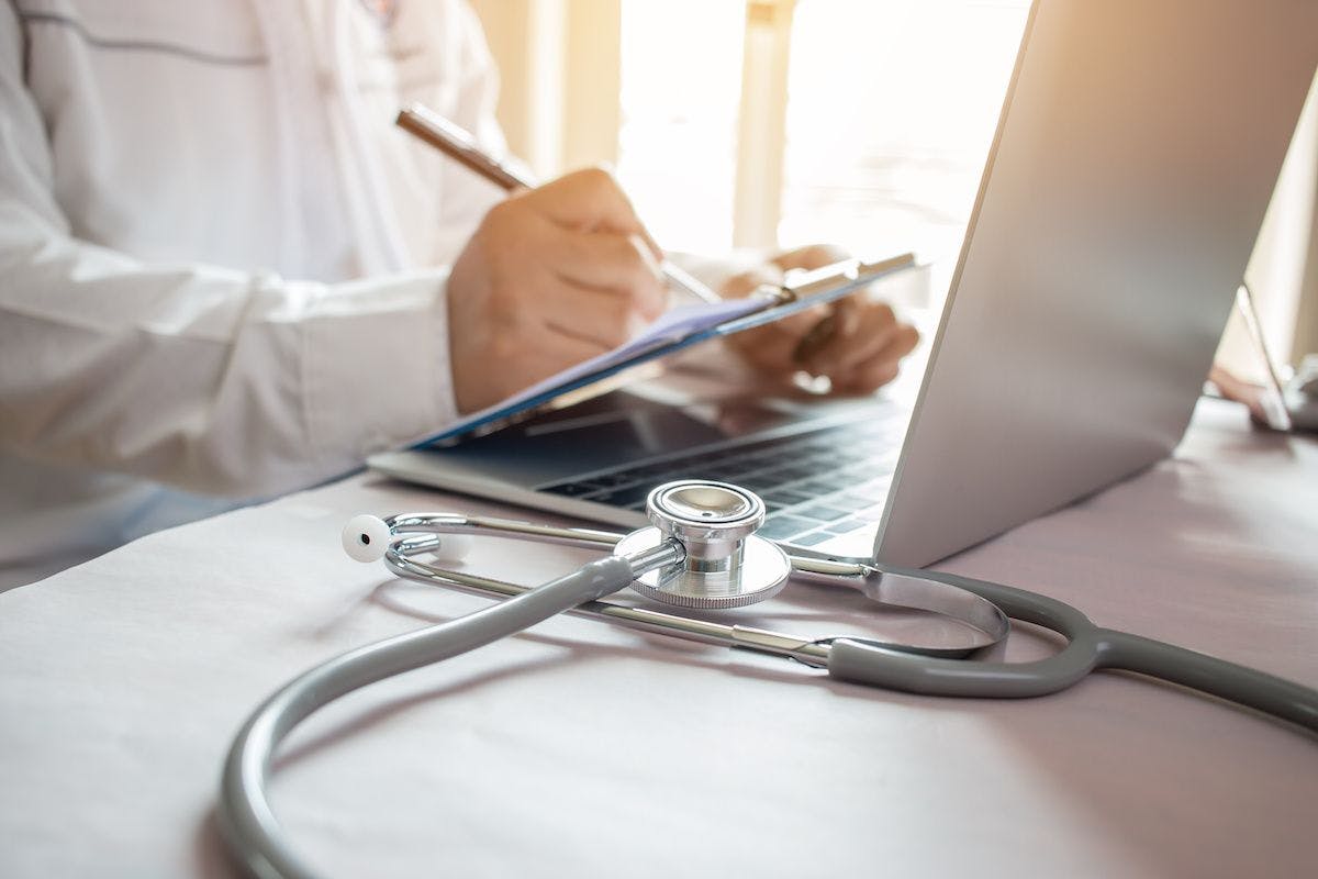 Medicine doctor's writing on laptop in medical office.Focus stethoscope on foreground table in hostpital.Stethoscope is acoustic medical device for auscultation,listening internal sounds of human... | ©smolaw11 | Adobe Stock