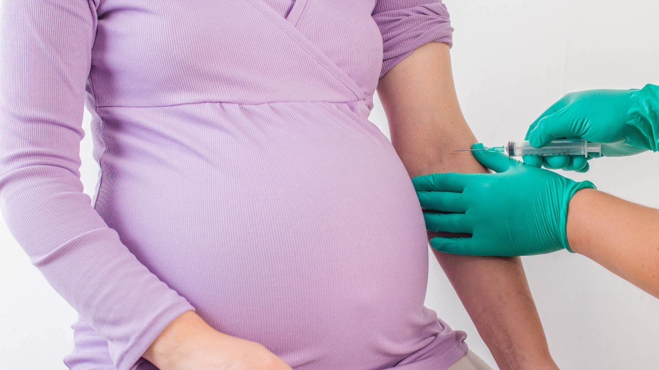 The doctor takes a biochemical blood test from a pregnant girl for infections and blood sugar levels. Mycoplasmosis. Image Credit: Adobe Stock Images/HENDAZY