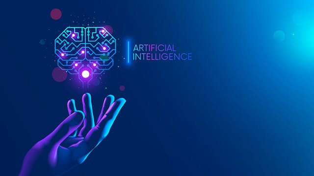 Image credit: AndSus | stock.adobe.com. Circuit board in shape electronic brain with gyrus, symbol ai hanging over hand. Symbol of computer neural networks or artificial intelligence in neon cyberspace with glowing title on palm scientist