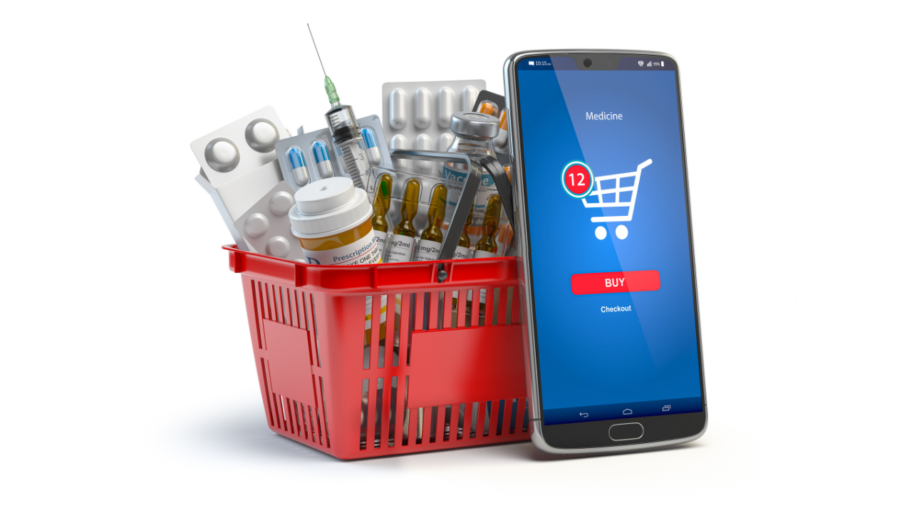 Mobile service or app for purchasing medicines in online pharmacy drugstore. Smartphone and shopping basket full of medicines. Image Credit: Adobe Stock Images/Maksym Yemelyanov