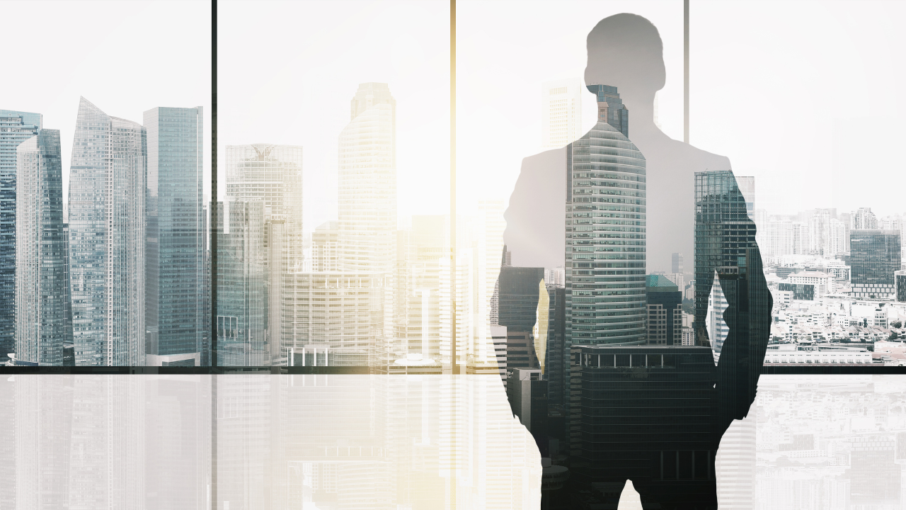 silhouette of business man over office background. Image Credit: Adobe Stock Images/Syda Productions