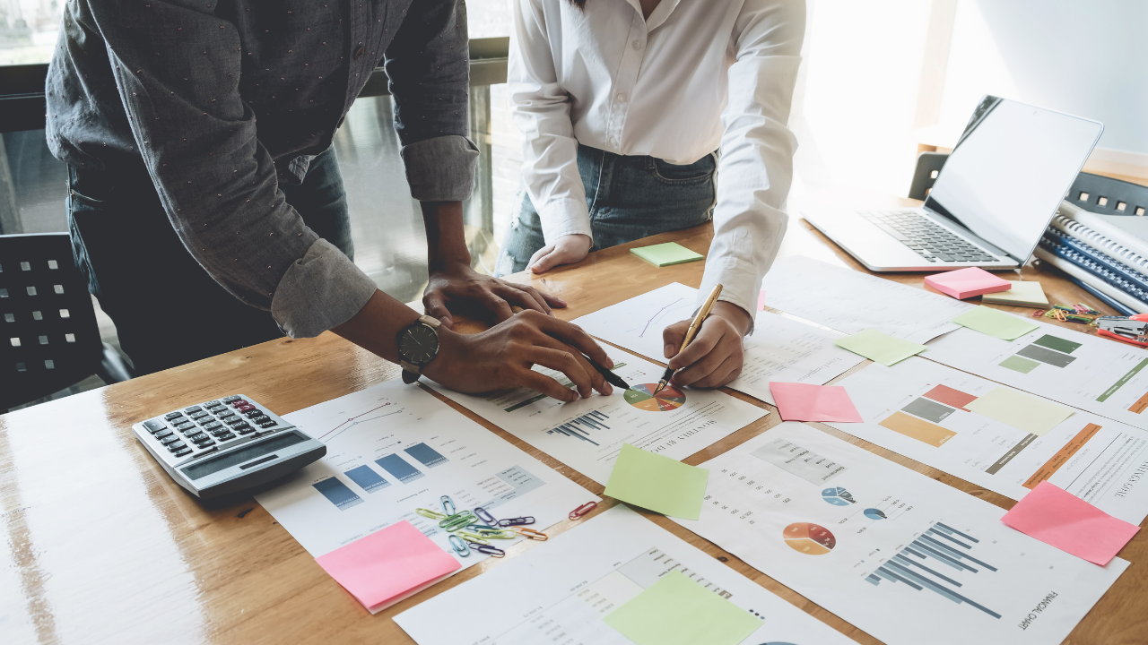 Business People Planning Strategy Analysis from financial document report, Office Concept. Image Credit: Adobe Stock Images/Natee Meepian
