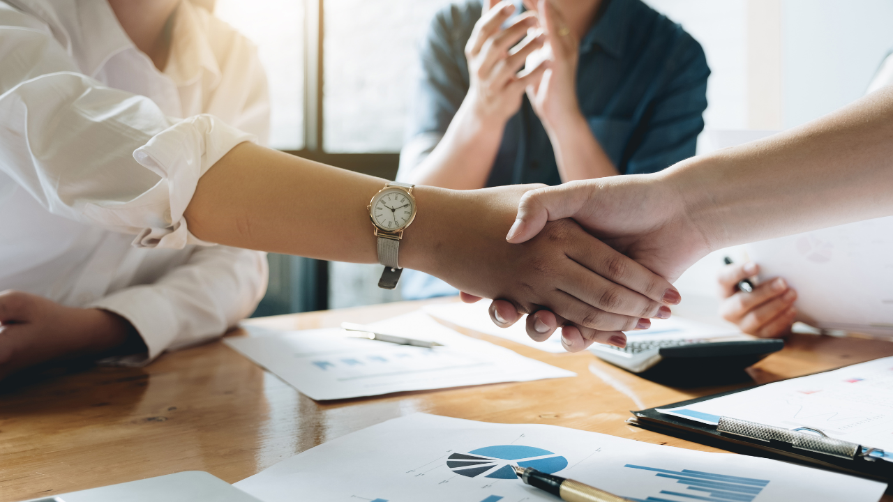 Close up of Business people shaking hands, finishing up meeting, business etiquette, congratulation, merger and acquisition concept. Image Credit: Adobe Stock Images/Natee Meepian