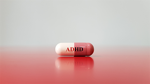 Medication capsule for treatment ADHD(Attention deficit hyperactivity disorder)on red white background. This is mental disorder of neural development cause behavior problem. Medical technology concept | Credit: Adobe Stock Images/Joel bubble ben