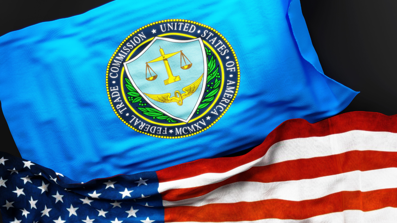 Flag of the United States Federal Trade Commission along with a flag of the United States of America as a symbol of a connection between them, 3d illustration. Image Credit: Adobe Stock Images/GoodIdeas