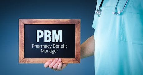 PBM (Pharmacy Benefit Manager). Doctor shows sign/board with wooden frame. Background blue By MQ-Illustrations | Adobe Stock